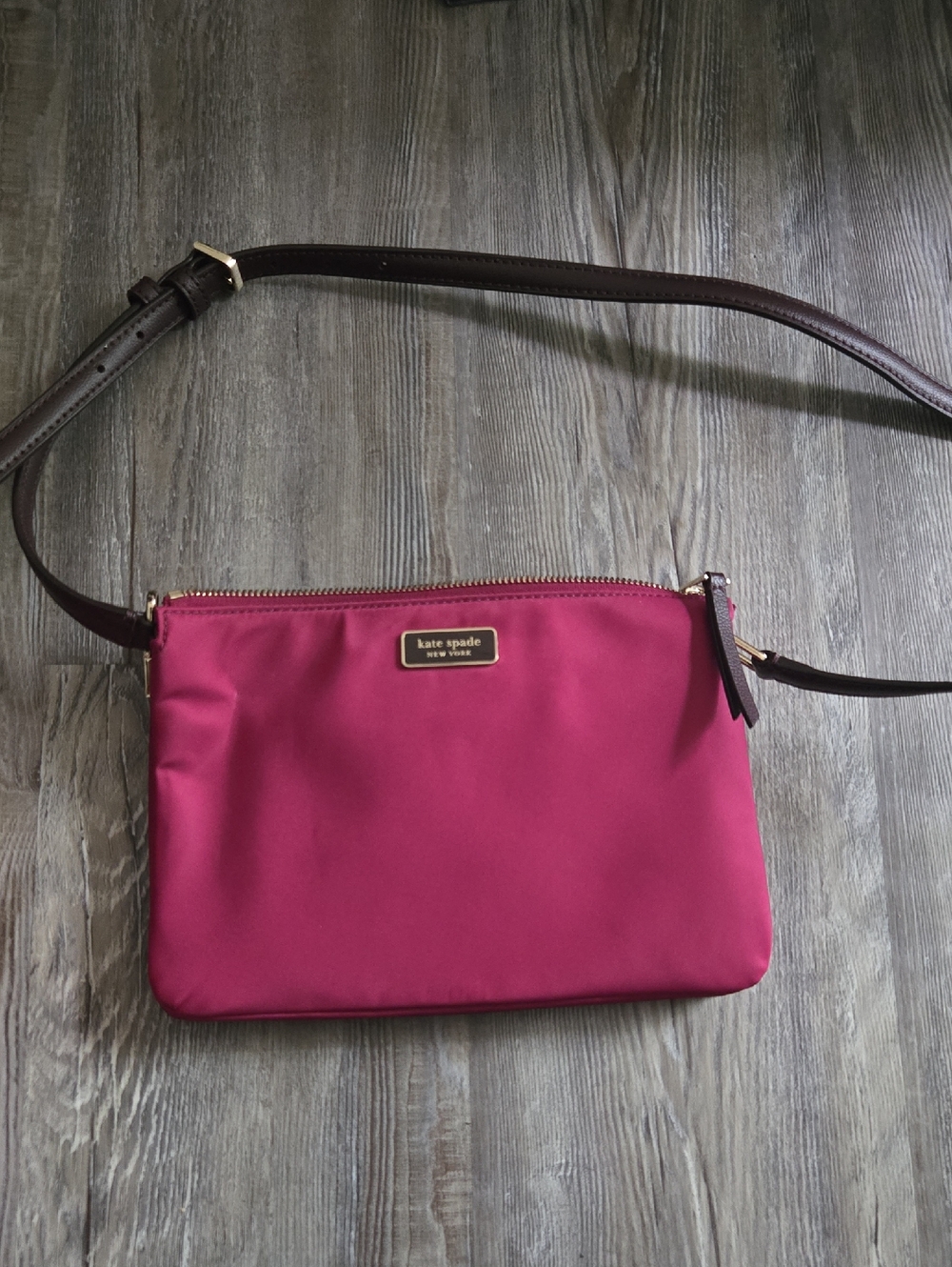 kate spade raspberry pink crossbody with dark brown strap